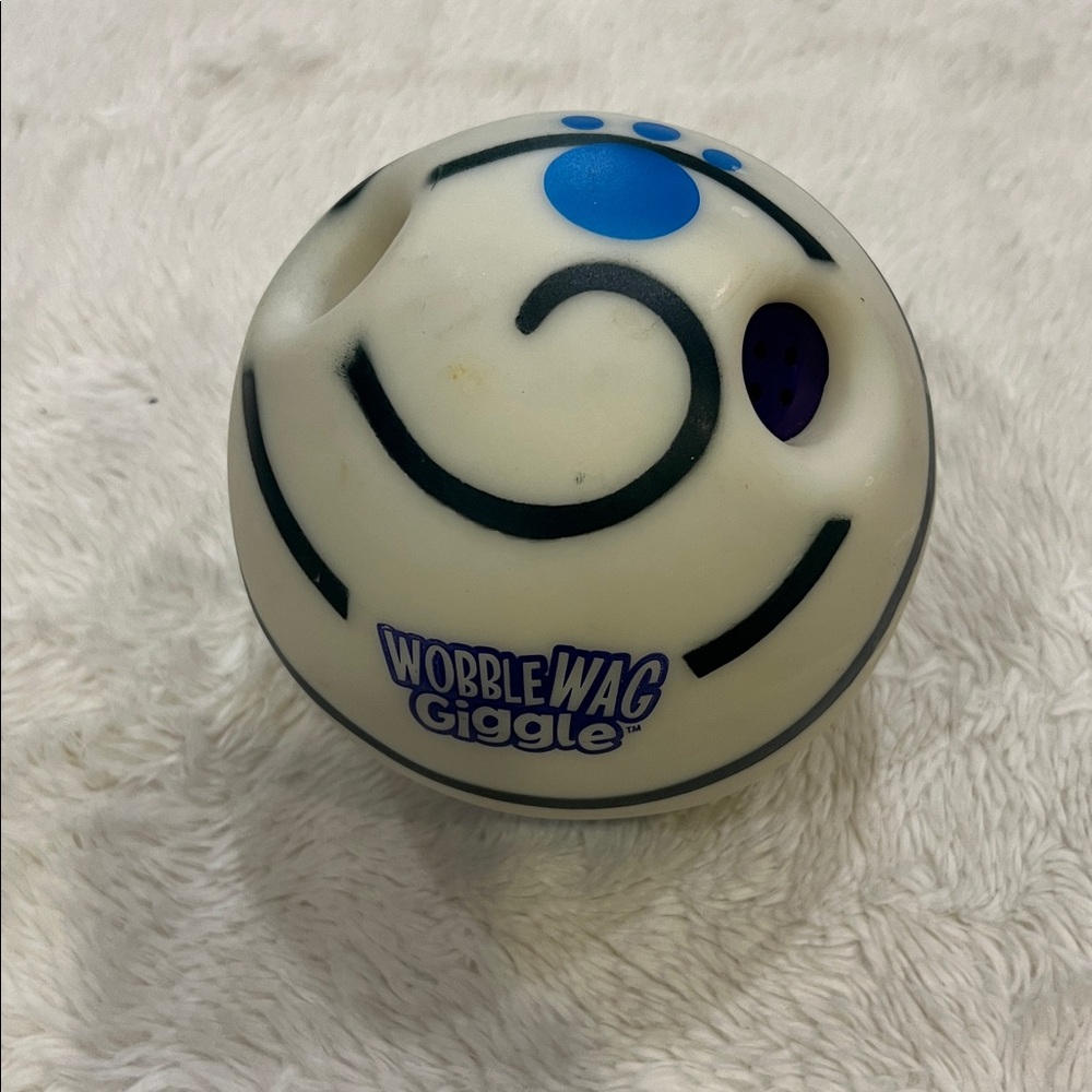 Slightly used Wobble Wag Giggle dog toy made of durable hard plastic.